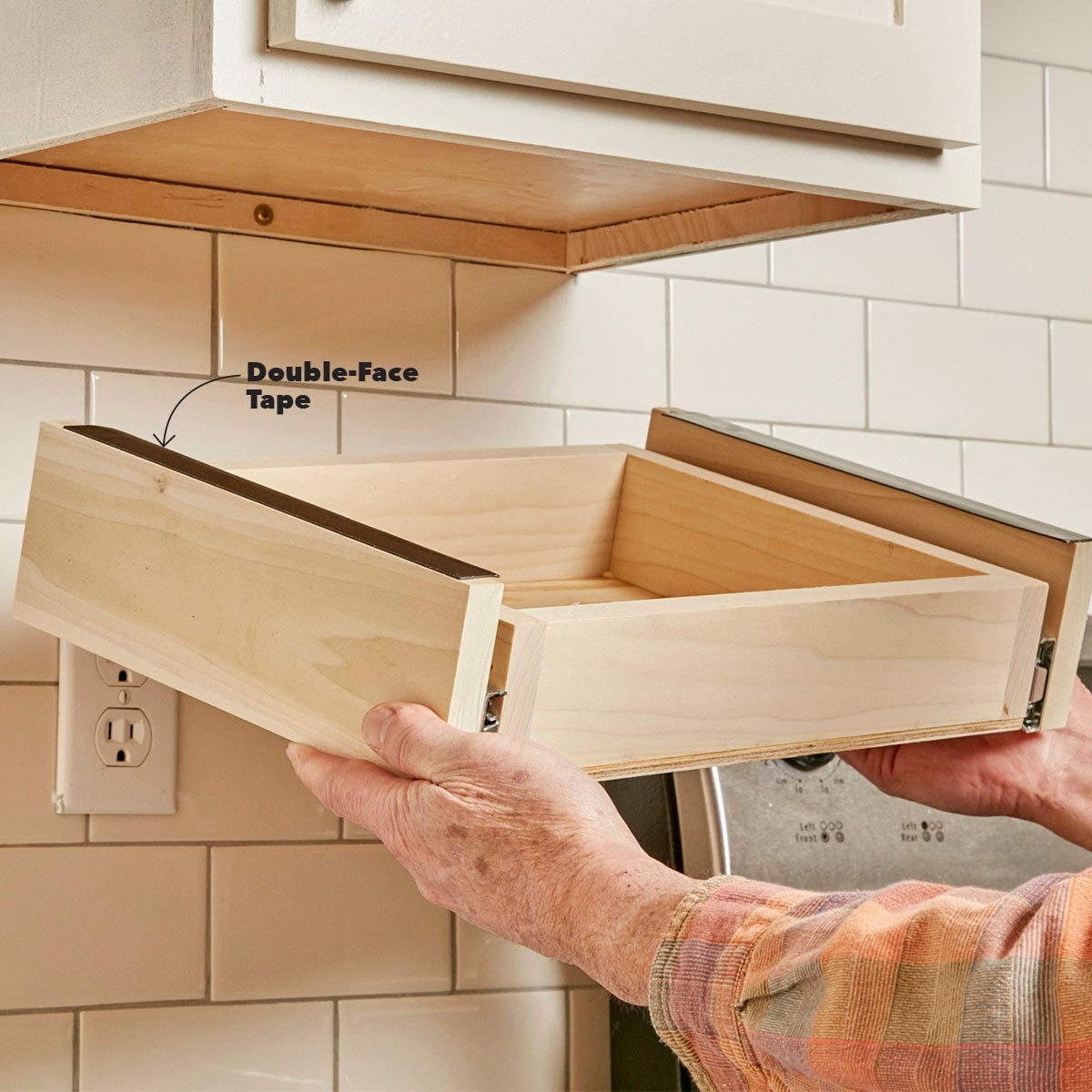 place under-cabinet drawer assembly on cabinet
