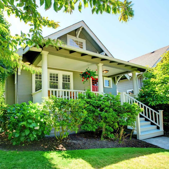 bungalow craftsman light green exterior siding front porch