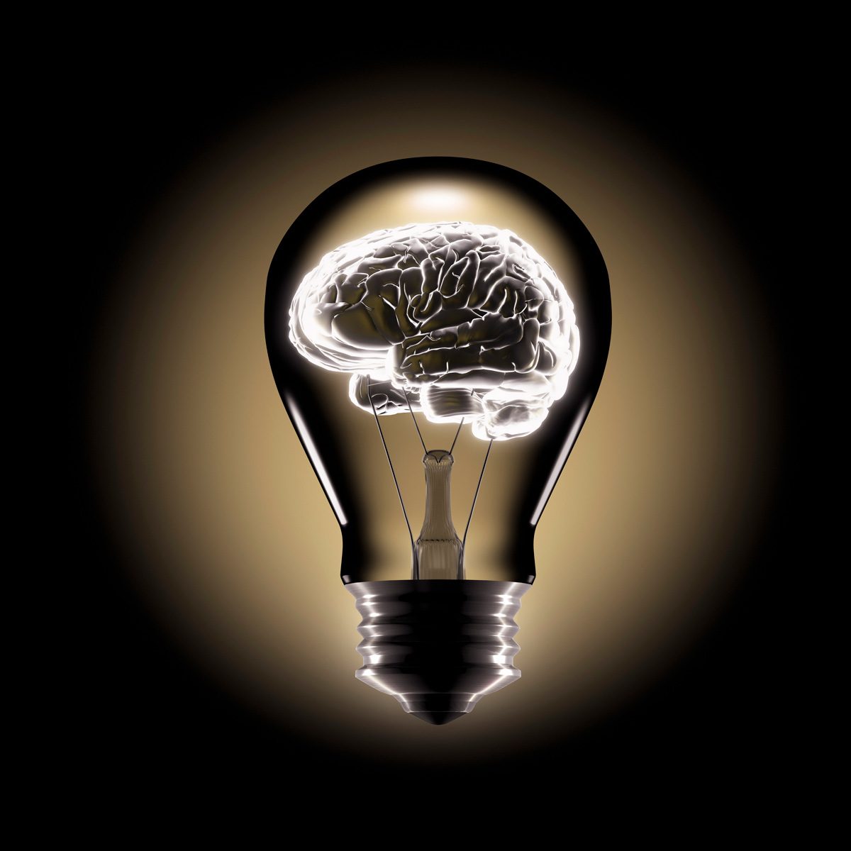 A light bulb contains a glowing brain inside, symbolizing ideas or intellect, against a dark background that emphasizes the bulb's illuminated features.