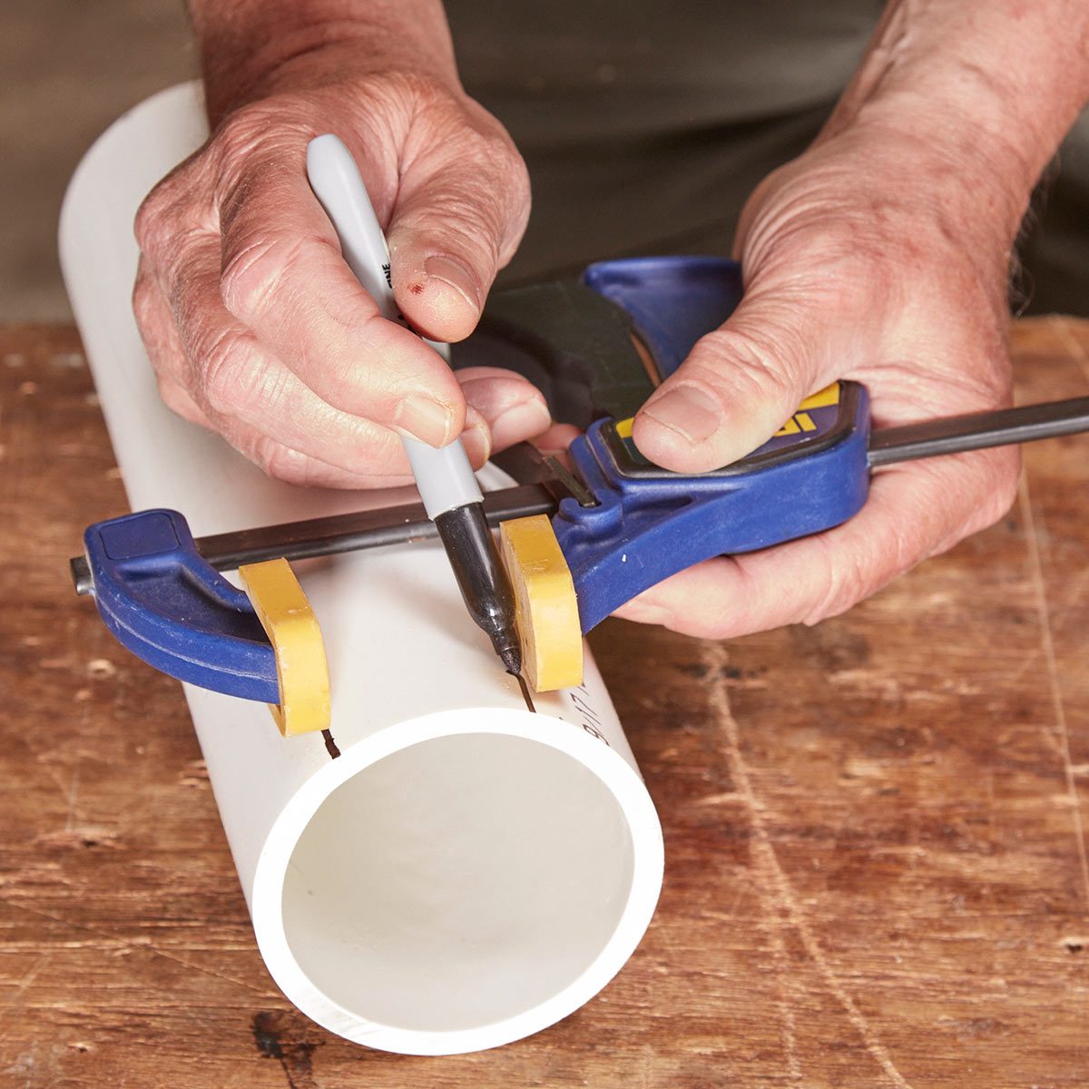 measure pvc pipe with clamp and sharpie