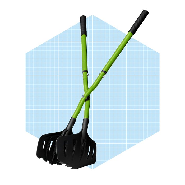Two green gardening tools with black scoops intersect at the handles, set against a light blue grid background, suggesting a design or promotional context.