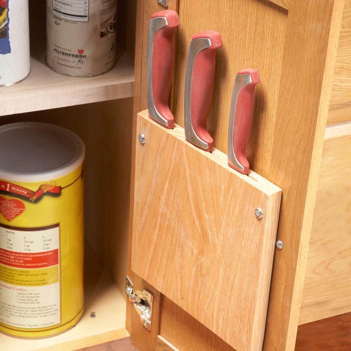 hidden knife storage on the inside of a cabinet fh11jau_520_33_016