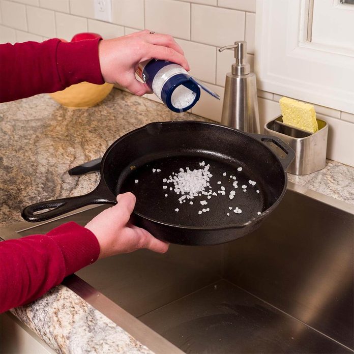 clean cast iron skillet with coarse salt