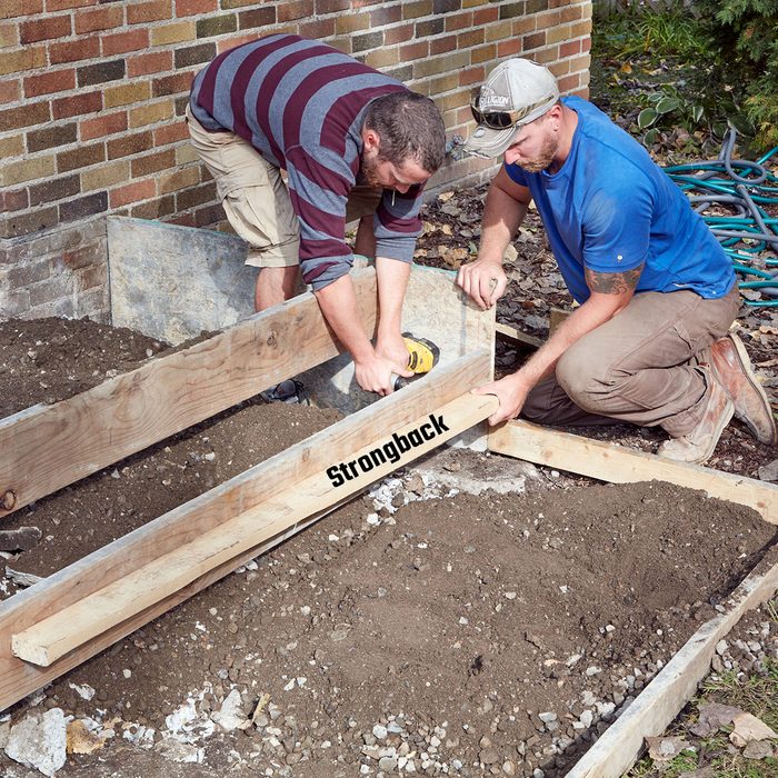 Reinforcing the step form board with strongback | Construction Pro Tips