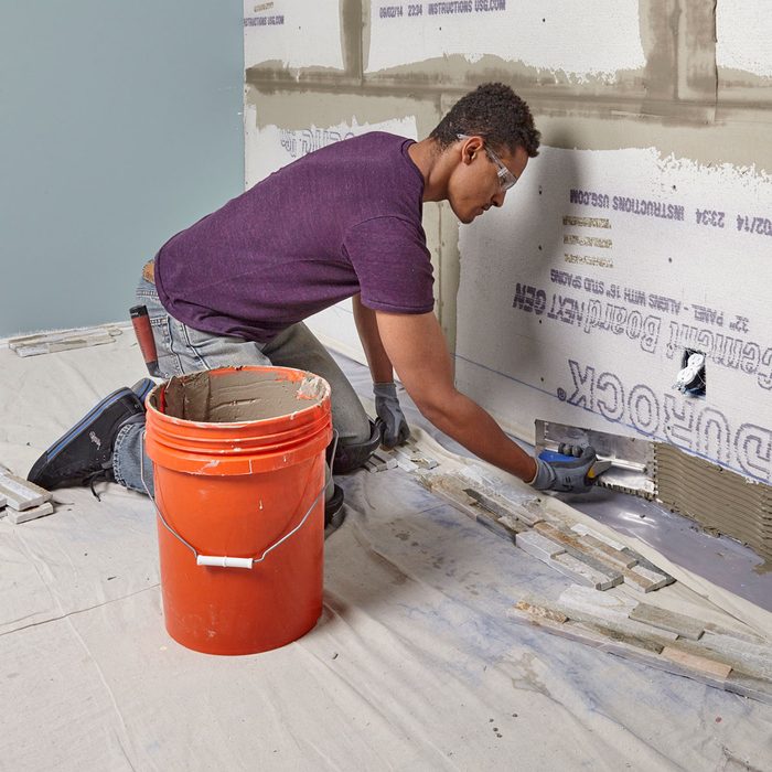 Spread thin-set along the bottom part of the wall