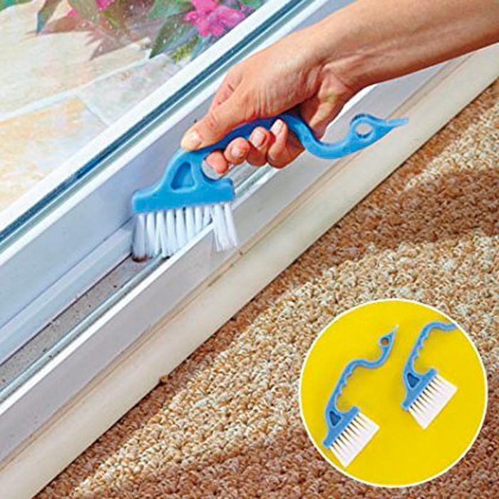 A blue cleaning tool with bristles is used to scrub a window track, while a circular inset shows two additional similar tools on a yellow background.