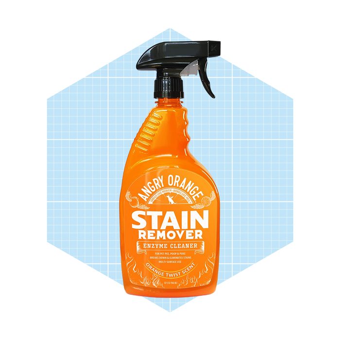 A bright orange spray bottle labeled 