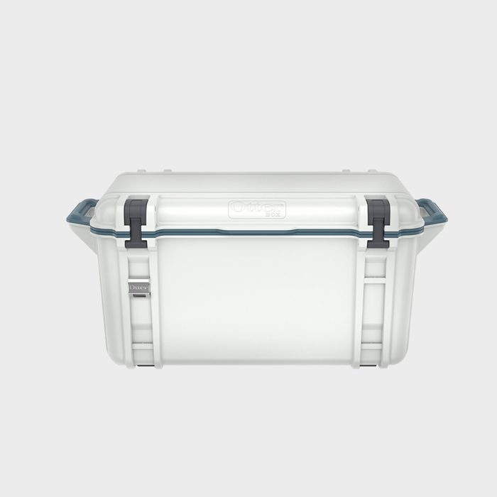 A sturdy, rectangular cooler sits upright, featuring a latch and carrying handles, set against a simple, neutral background.