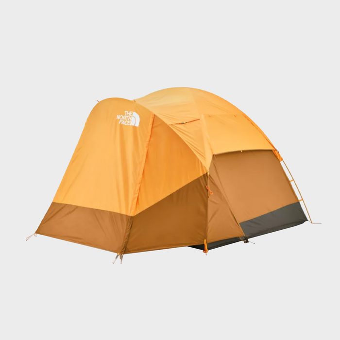 An orange tent stands upright, showcasing its structure. It is placed against a neutral background, implying a camping or outdoor context.