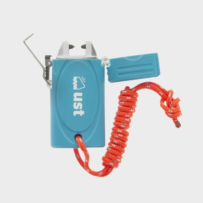 A compact, blue fire starter with a silver hook and orange cord is shown. It's designed for igniting fires in outdoor settings.