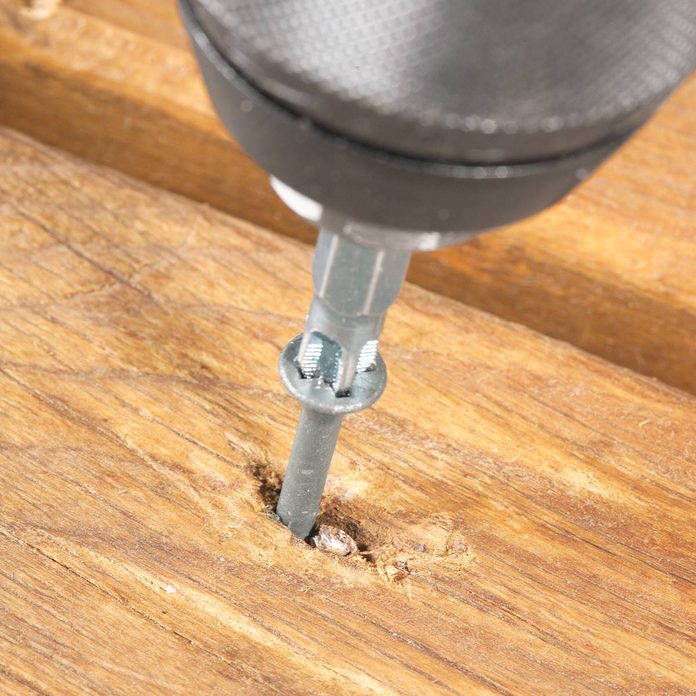 screw over stubborn nail