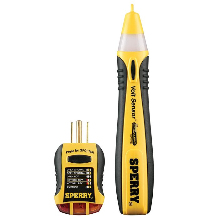 A volt sensor and outlet tester sit side by side. The volt sensor detects electrical voltage; the outlet tester evaluates wiring safety. Both are yellow and black.