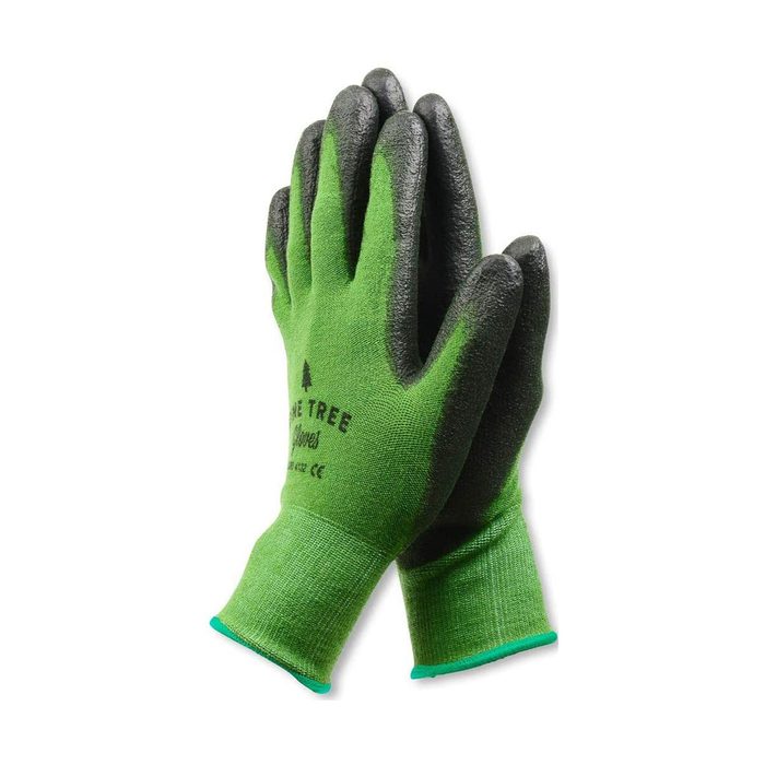 Green gardening gloves with black fingertips rest together, ready for use in outdoor activities, emphasizing protection and grip in a gardening context.
