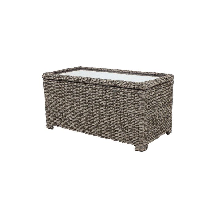 A rectangular, woven storage chest with a glass top sits on four legs. It is designed for outdoor use, providing a stylish storage solution.