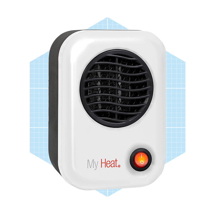 A compact space heater emits heat, with a power indicator light glowing, set against a light blue geometric background.