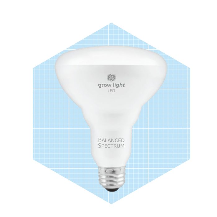 A white LED grow light is displayed, designed for supporting plant growth, set against a light blue grid background.