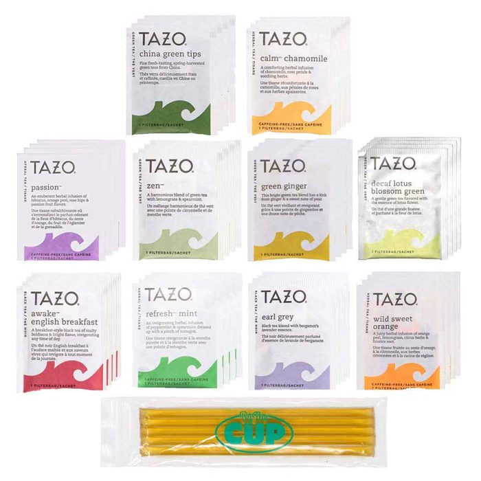 Assorted TAZO tea packets are neatly arranged, showcasing various flavors, alongside yellow straws labeled 