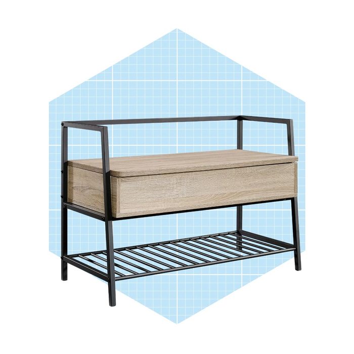 A wooden storage bench with a sliding drawer stands on a metal frame, surrounded by a light blue geometric background.