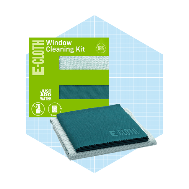 E-cloth window cleaning kit displayed with two cloths, suggesting cleaning action. Background features a light blue graph pattern, emphasizing a tidy environment.