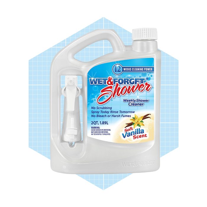A bottle of shower cleaner sits against a light blue geometric background, featuring a spray nozzle, labeling it as a weekly cleaner with vanilla scent.