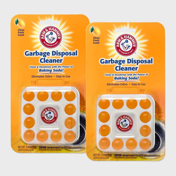 Two packages of orange cleaning capsules labeled 