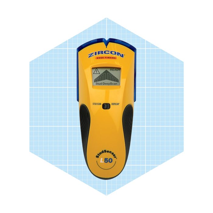 A yellow stud finder is displayed, indicating 
