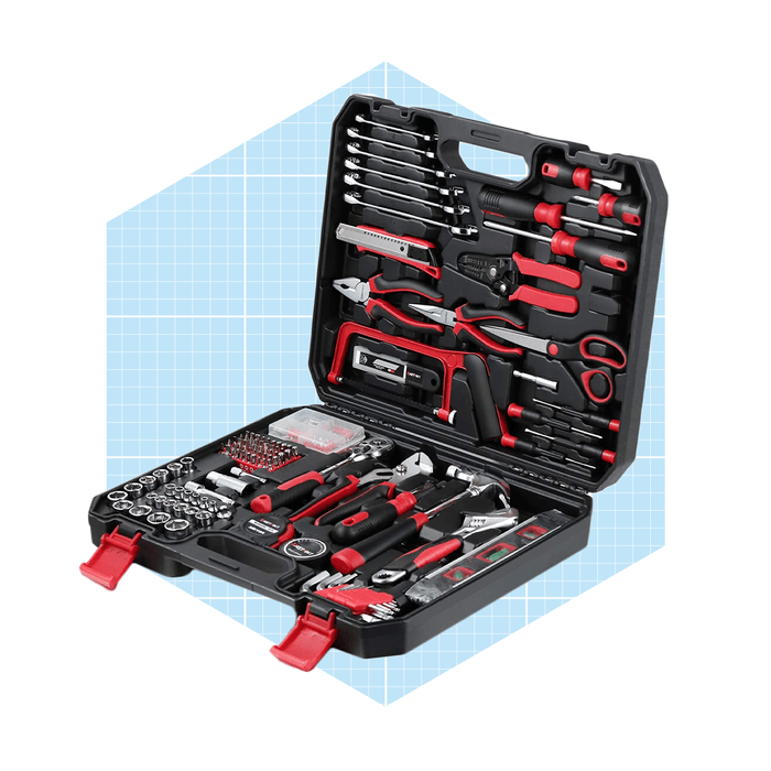 A black toolbox is open, displaying an arranged collection of various tools, including wrenches and screwdrivers, set against a light blue grid background.