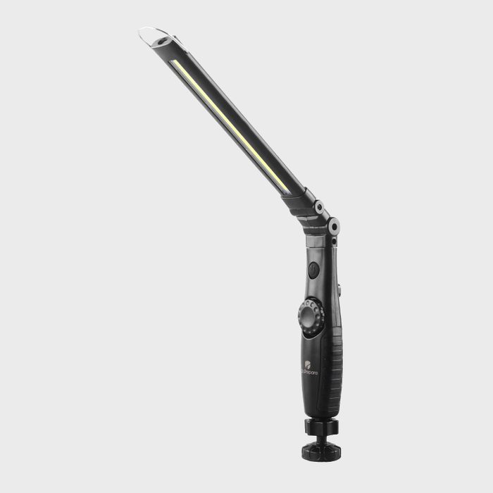 A handheld work light with an adjustable arm and a circular base illuminates spaces effectively, set against a neutral gray background.