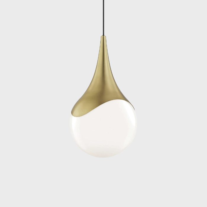 A pendant lamp with a teardrop shape hangs from a black cord against a plain gray background, featuring a gold top and white bottom half.