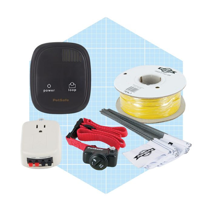 A PetSafe containment system includes a control unit, transmitter, collar, yellow wire, flags, and stakes, designed for monitoring pets within a defined area.