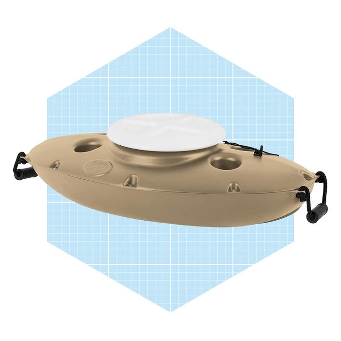 A beige kayak rests on a grid-patterned background, featuring a circular white top and multiple holes, ready for use on water.