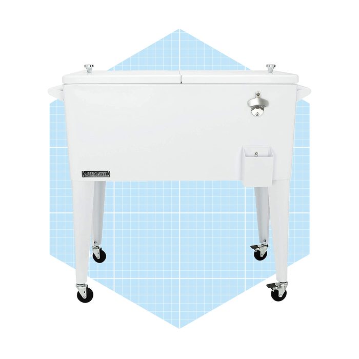 A white cooler rests on wheels, featuring a lid and a spigot, set against a light blue geometric background.