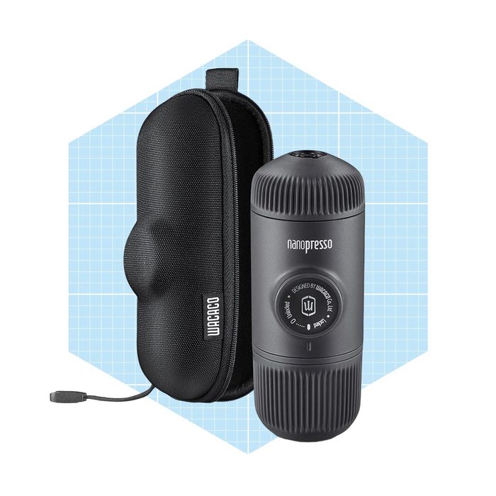 A portable espresso maker rests beside a protective case on a grid-patterned background, showcasing its sleek design and brand label.
