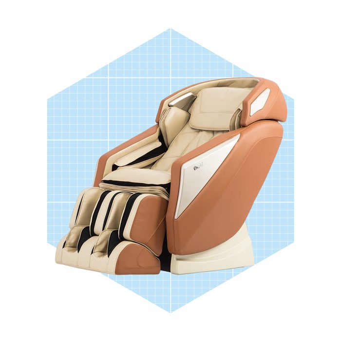 A massage chair with a cream and tan design sits prominently, featuring adjustable components and foot rollers, set against a light blue grid background.