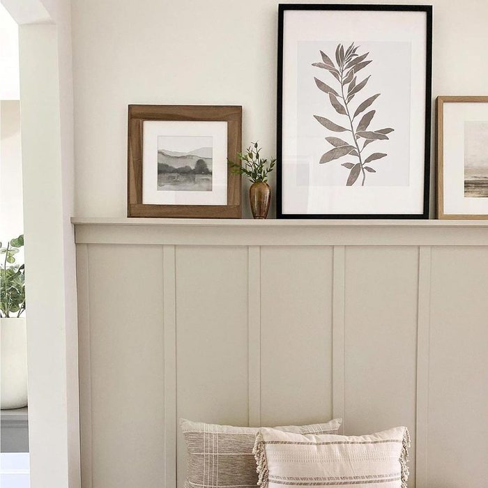 A room with Picture Ledge and photo frames