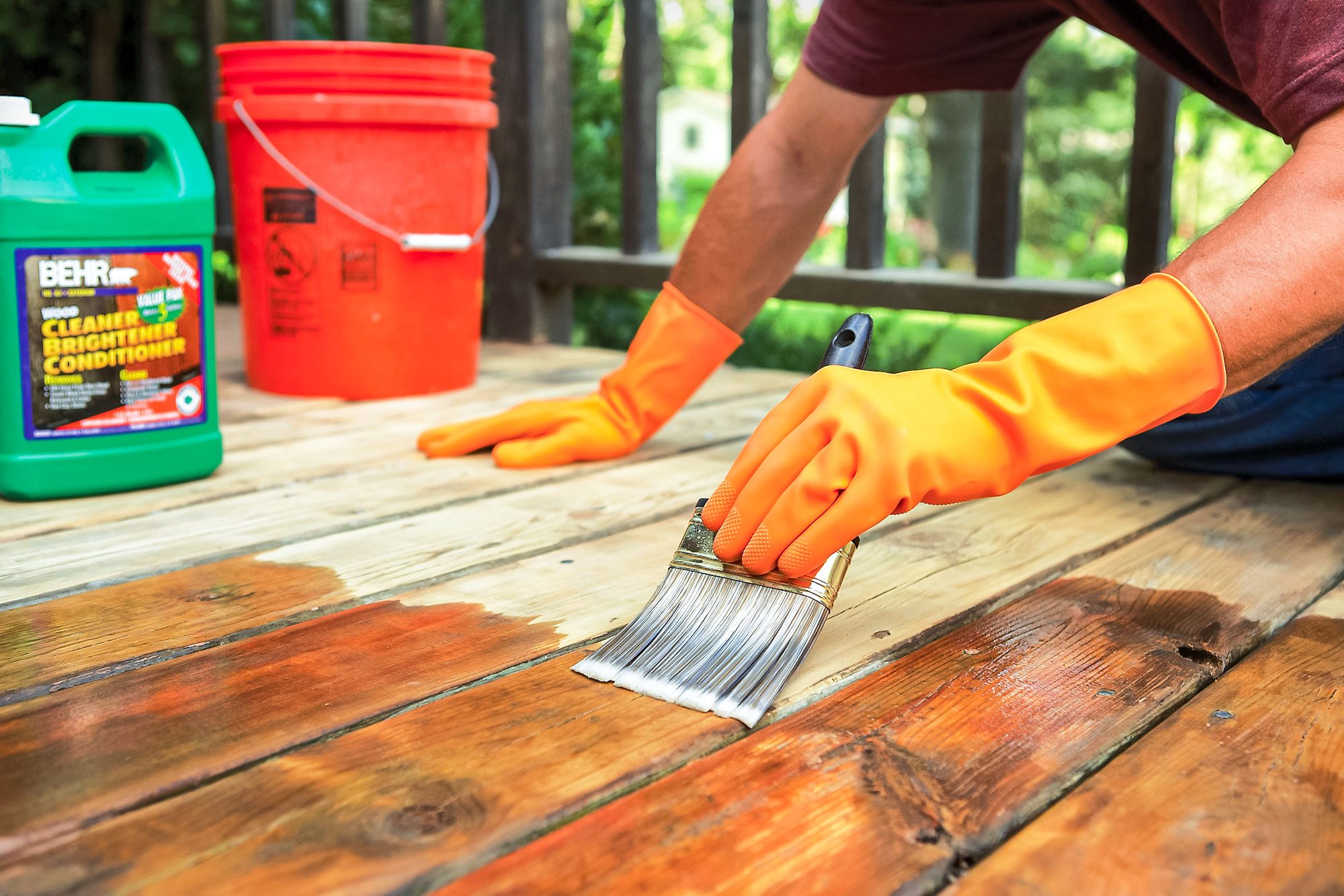 applying deck conditioner using brush