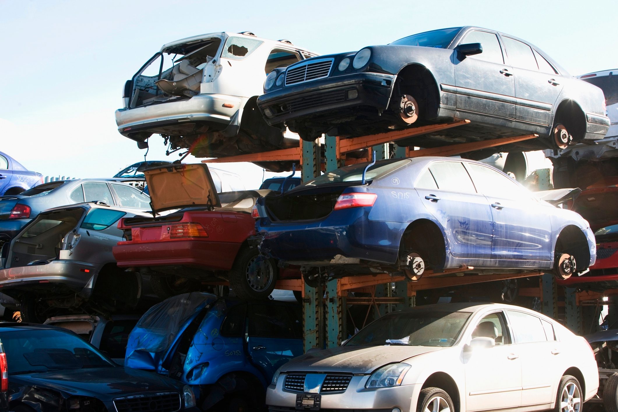 Cars sitting in junkyard