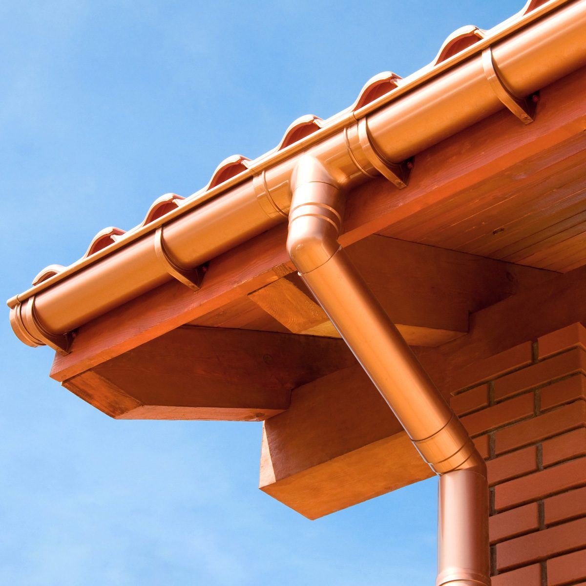 close up of copper rain gutter and downspout